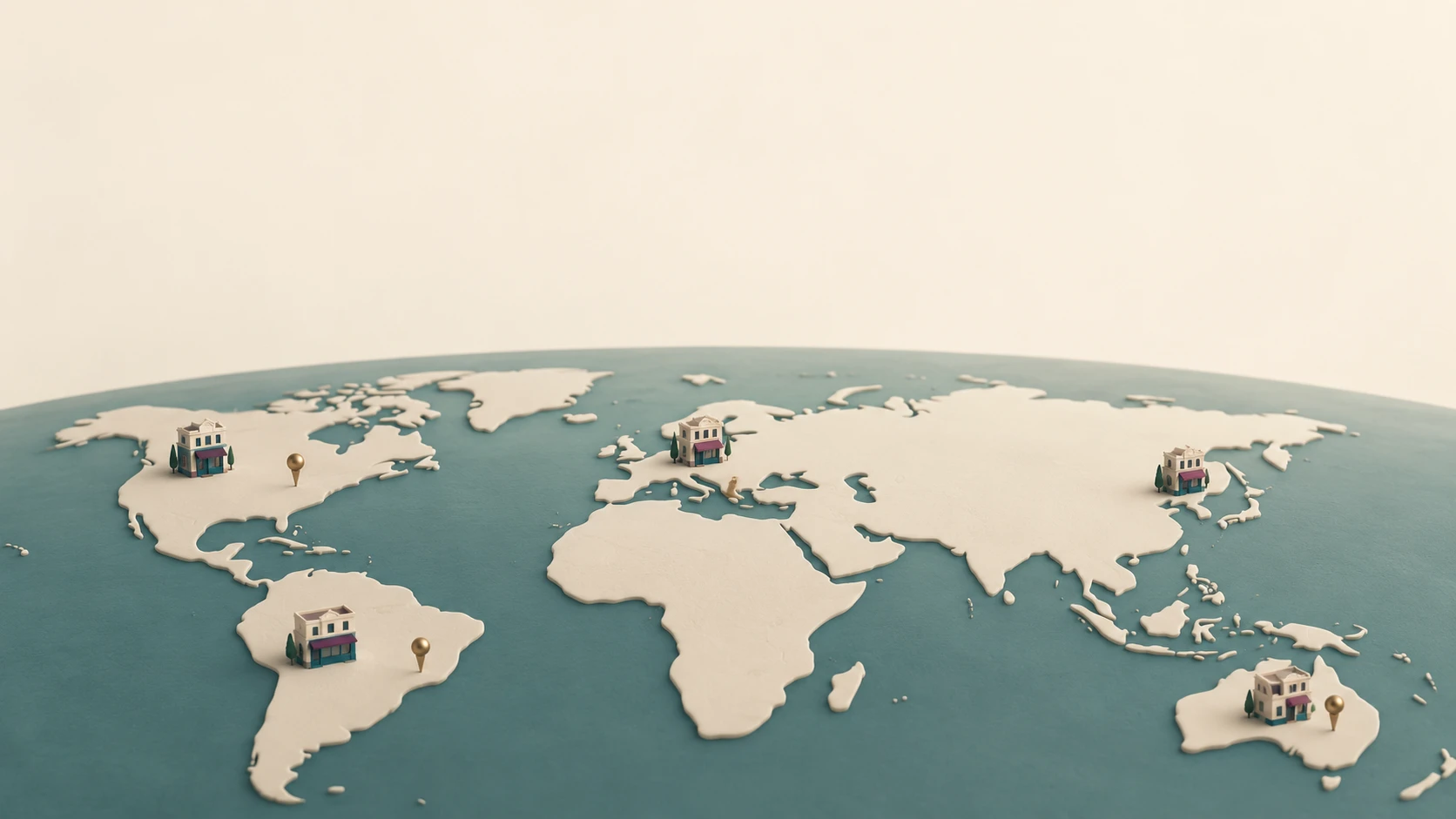 A curved miniature world map with ivory continents, a muted teal sea, and a few small bookshops